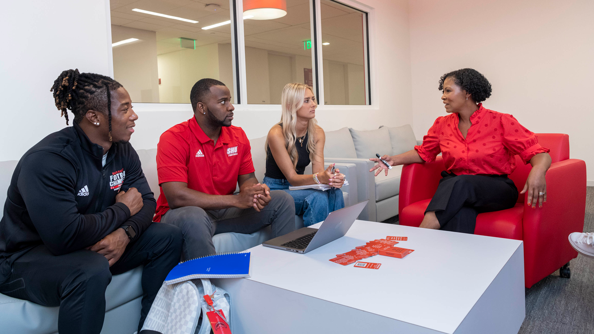 Students talking to tutor