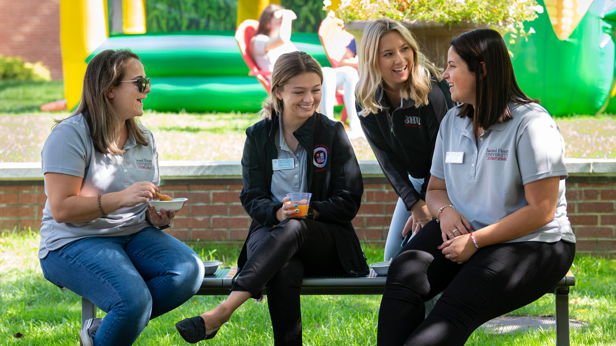Students sitting and talking outside