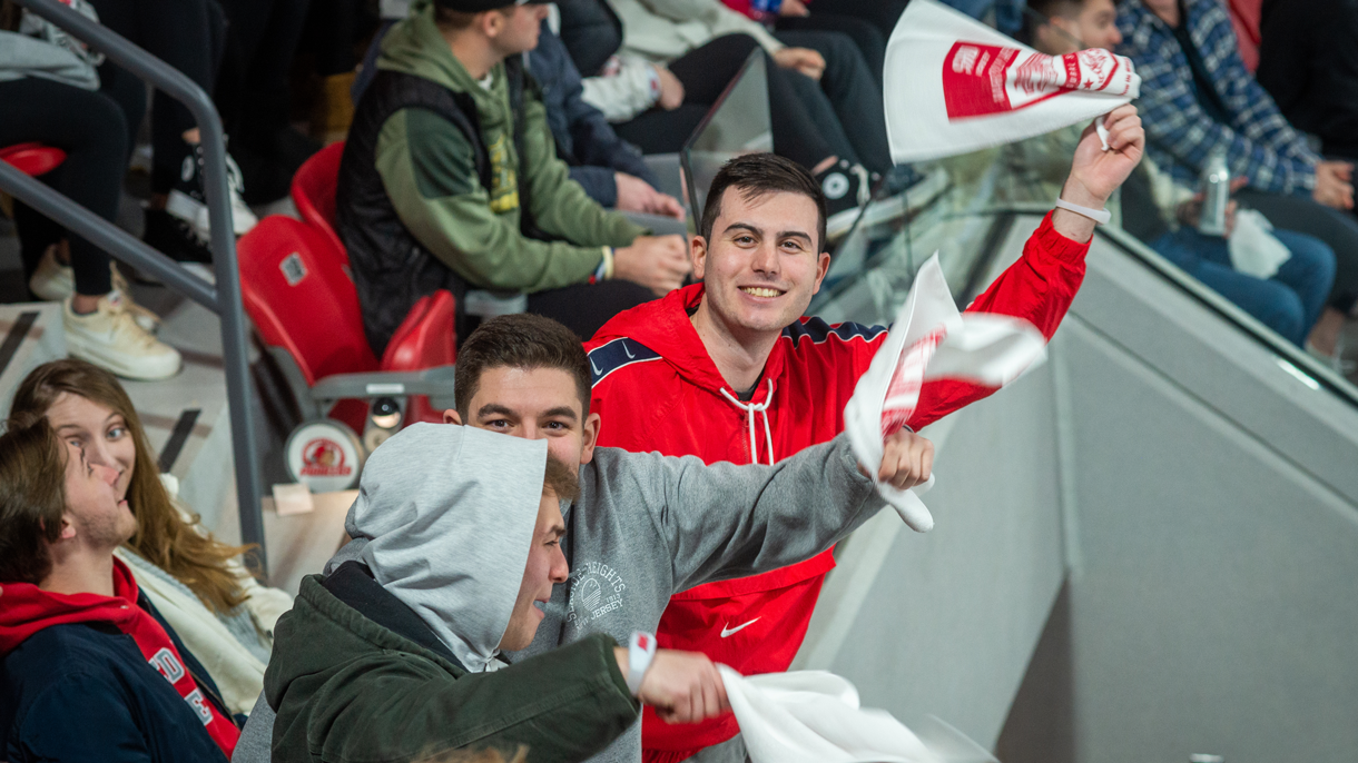 Students cheering at hockey game
