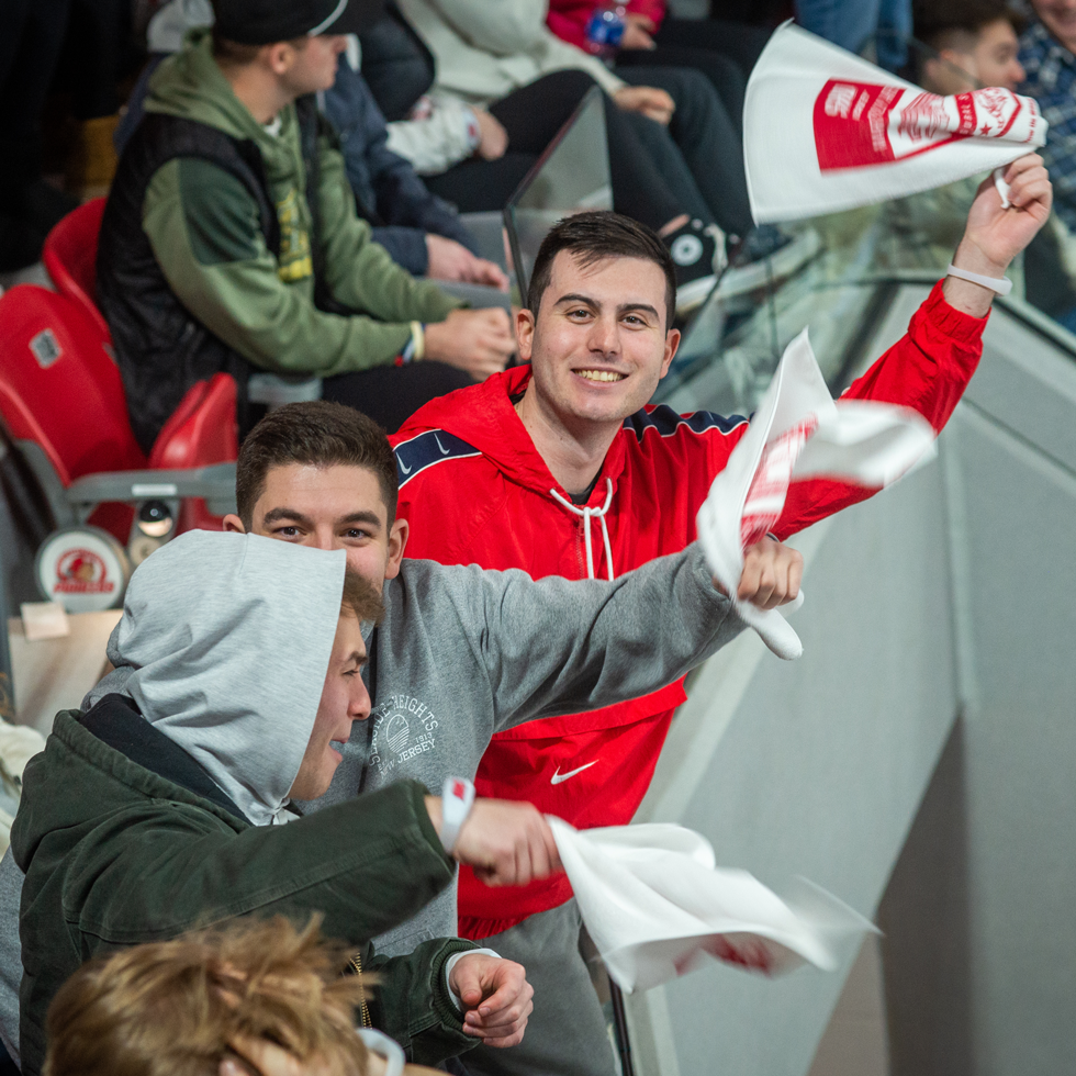 Students cheering at hockey game