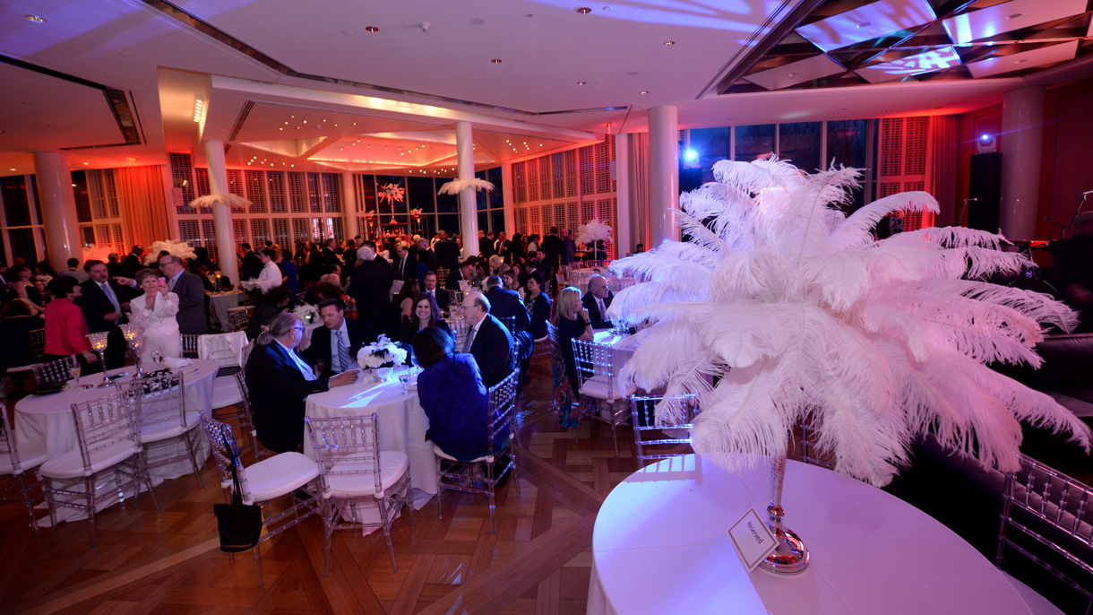 People sitting at tables in the Guest House Ballroom