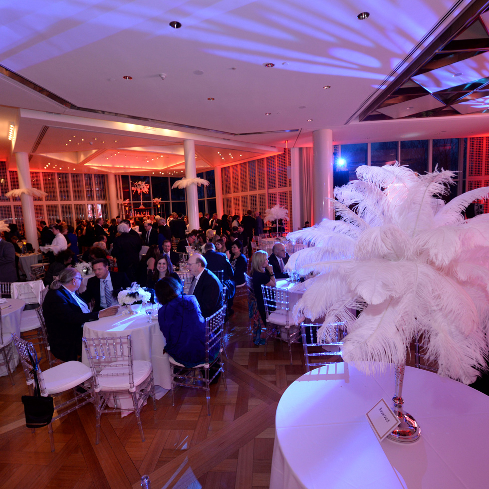 People sitting at tables in the Guest House Ballroom