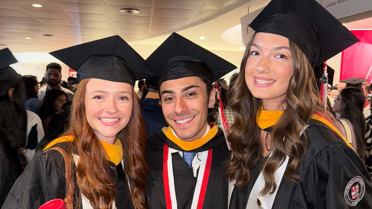Graduates holding their diplomas
