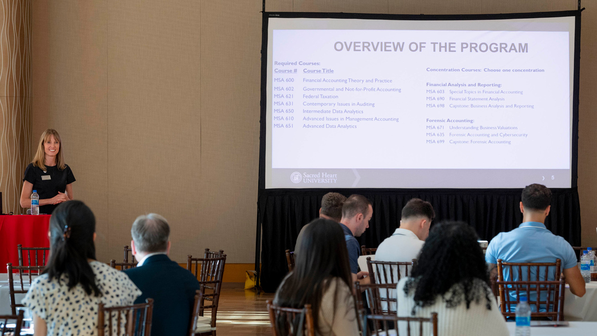 Woman speaking to students at orientation