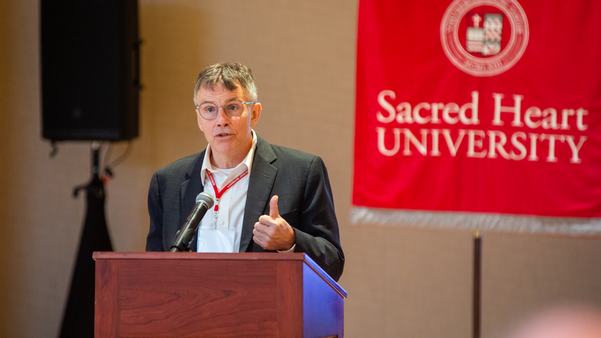 Ken Parker presenting at podium