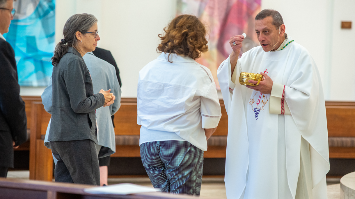 Woman taking communion