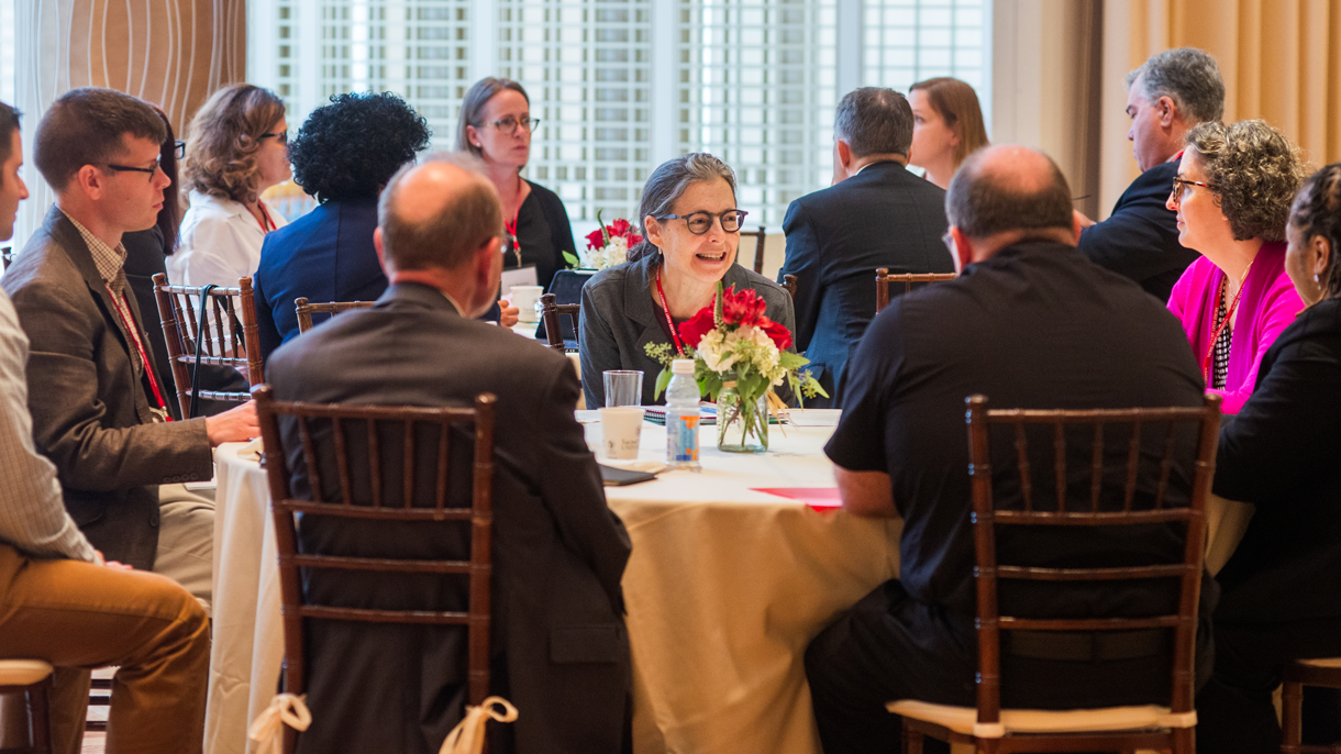 Catholic Studies Symposium participants engage is small group discussions
