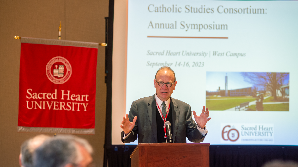 John Boyle presenting at podium