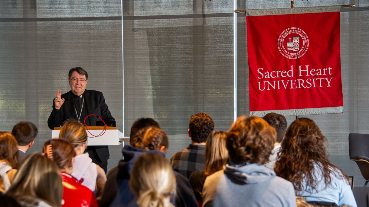 Archbishop Christophe Pierre, Apostolic Nuncio speaking to audience