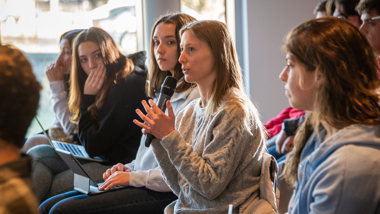Student asking question in audience