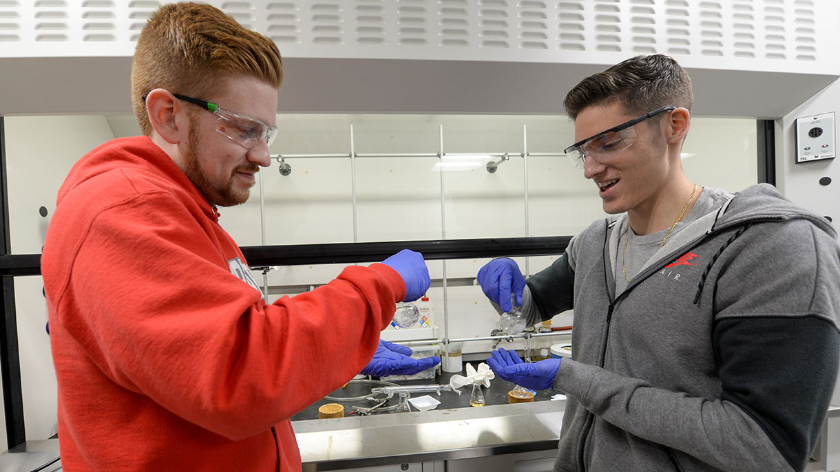 two sacred heart chemistry students
