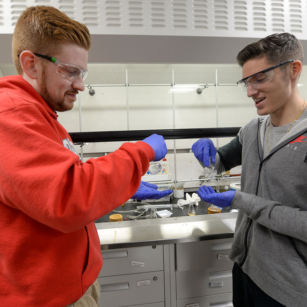 two sacred heart chemistry students
