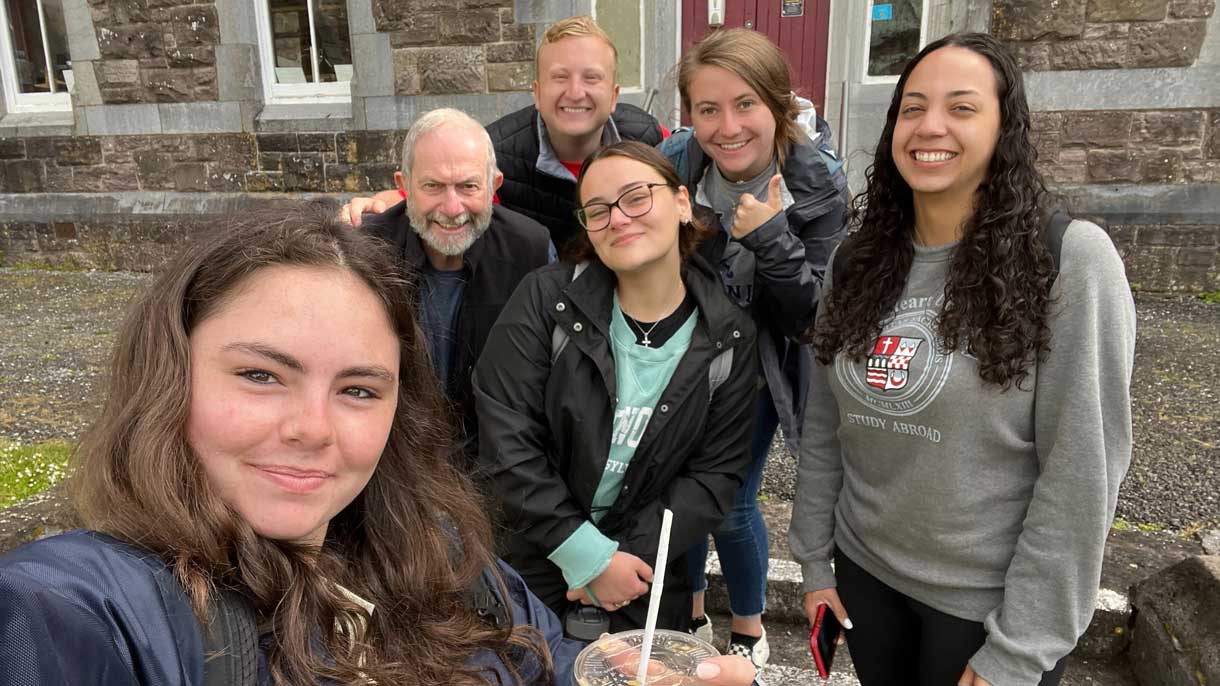Professor McCloghry and the economics course students pose in Dingle.