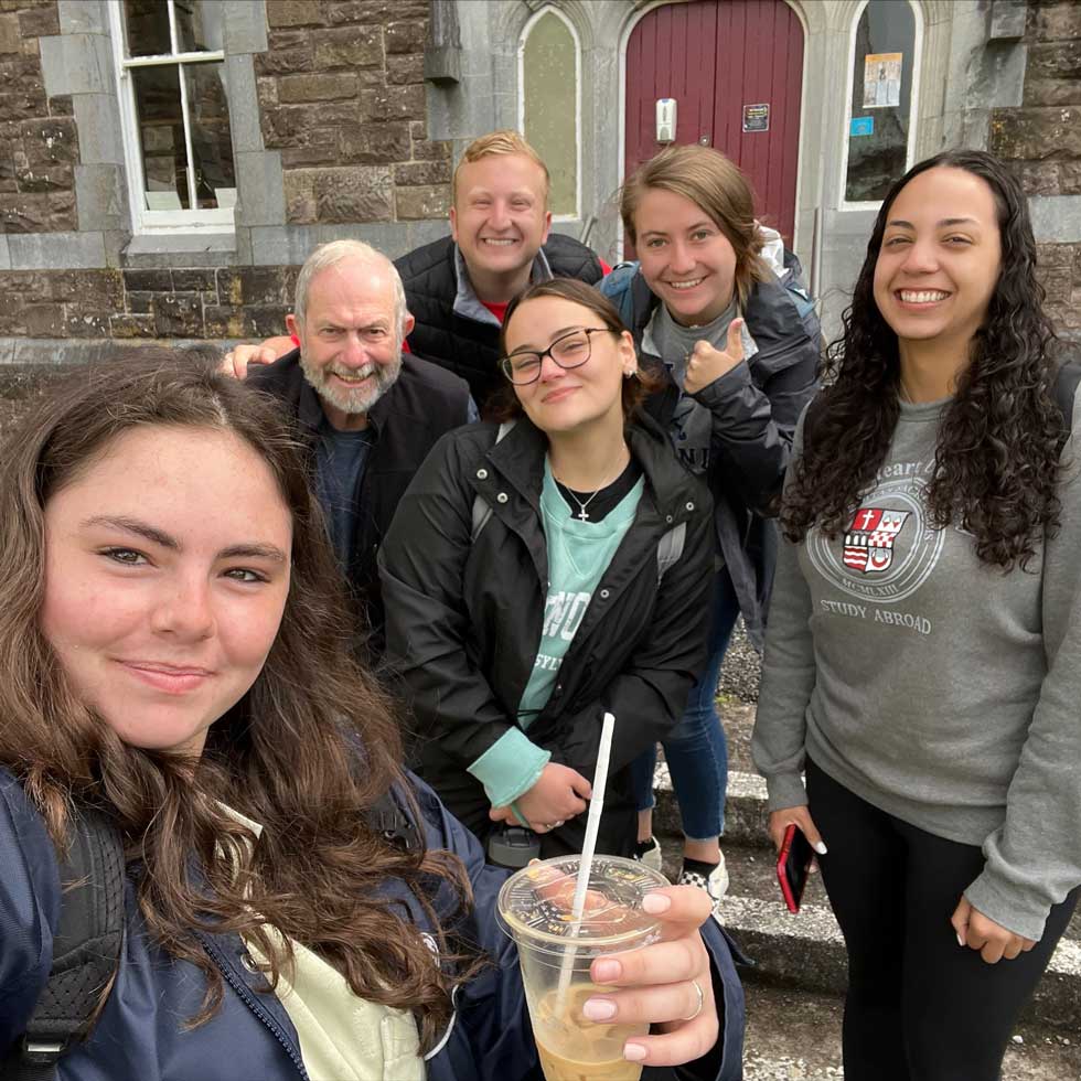 Professor McCloghry and the economics course students pose in Dingle.