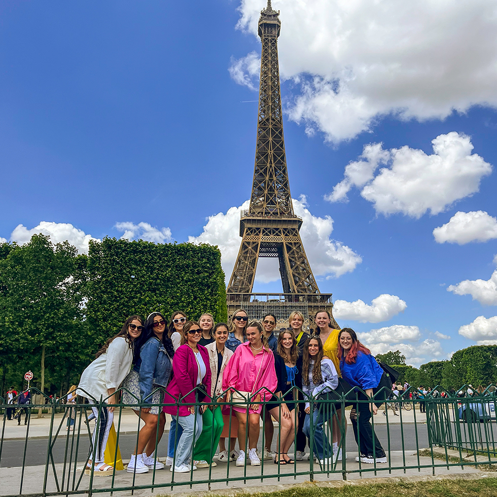 group photo of SHU students in front of the Eiffel Tower