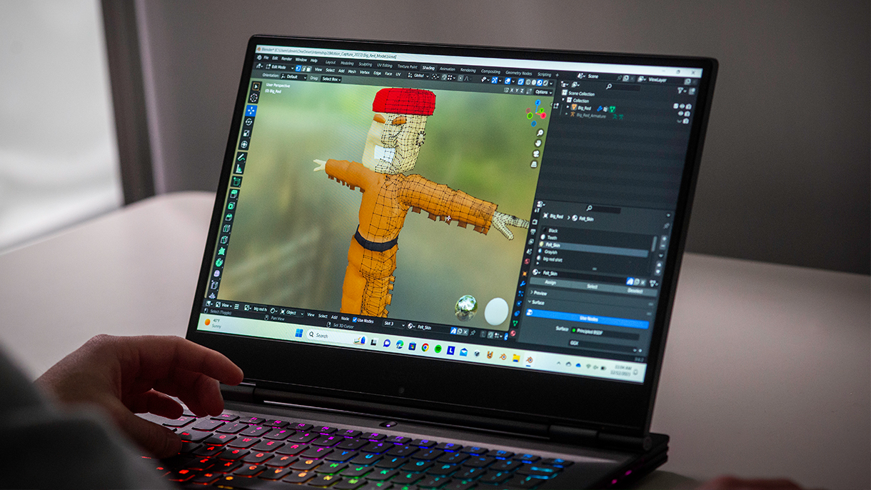 animation on a laptop screen of SHU mascot Big Red the Pioneer
