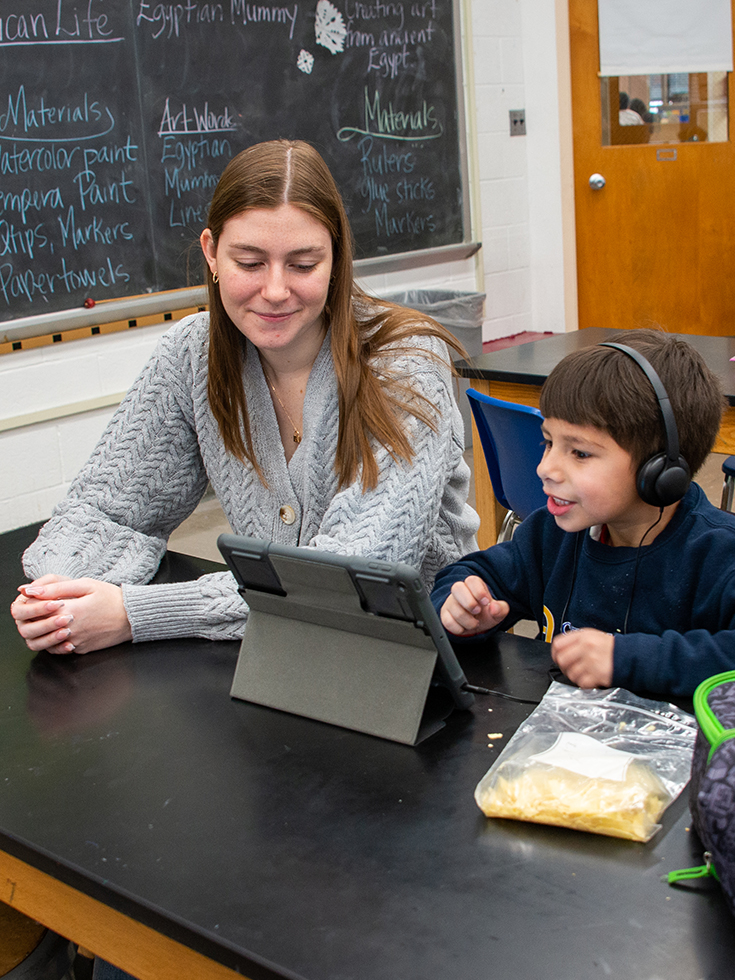 student teacher tutoring a child