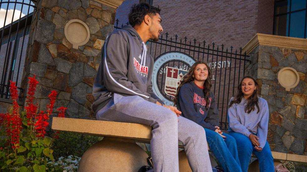 Students sitting on bench