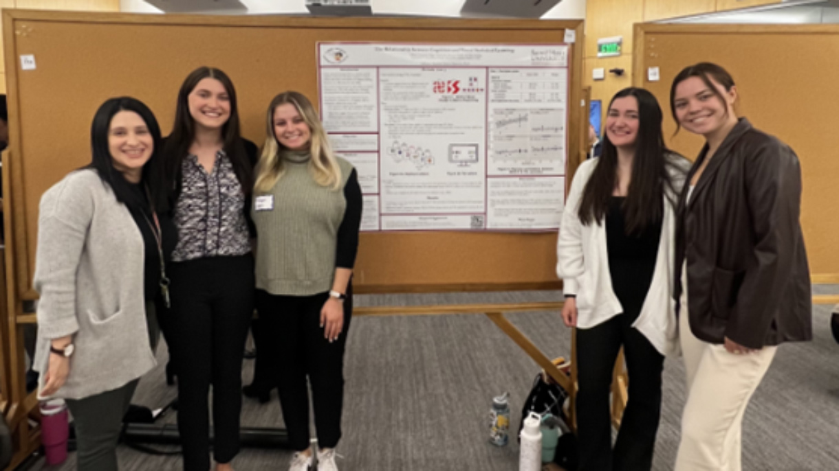 Group of women standing in front of bulletin board