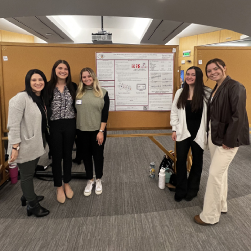 Group of women standing in front of bulletin board