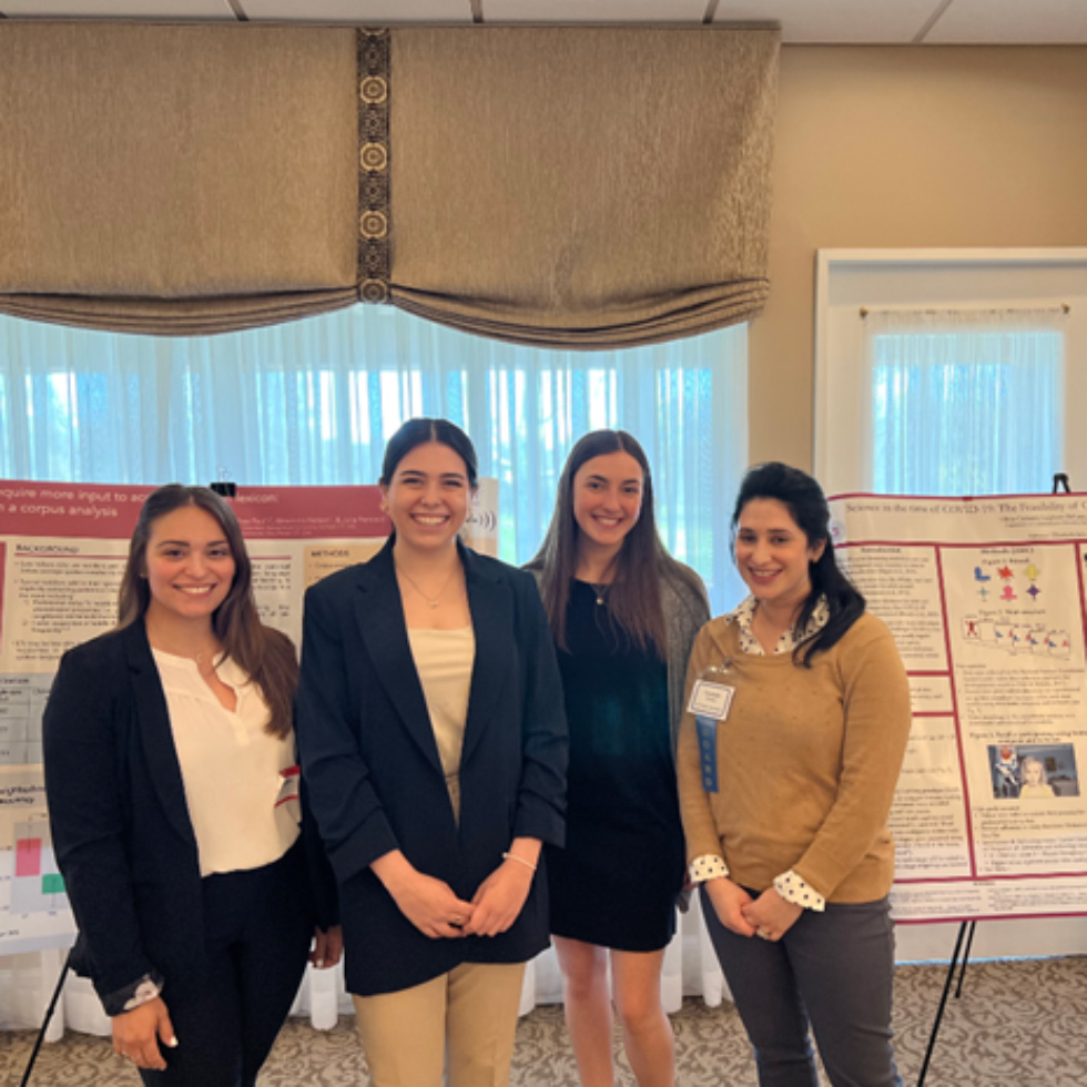 A group of women standing in front of posters
