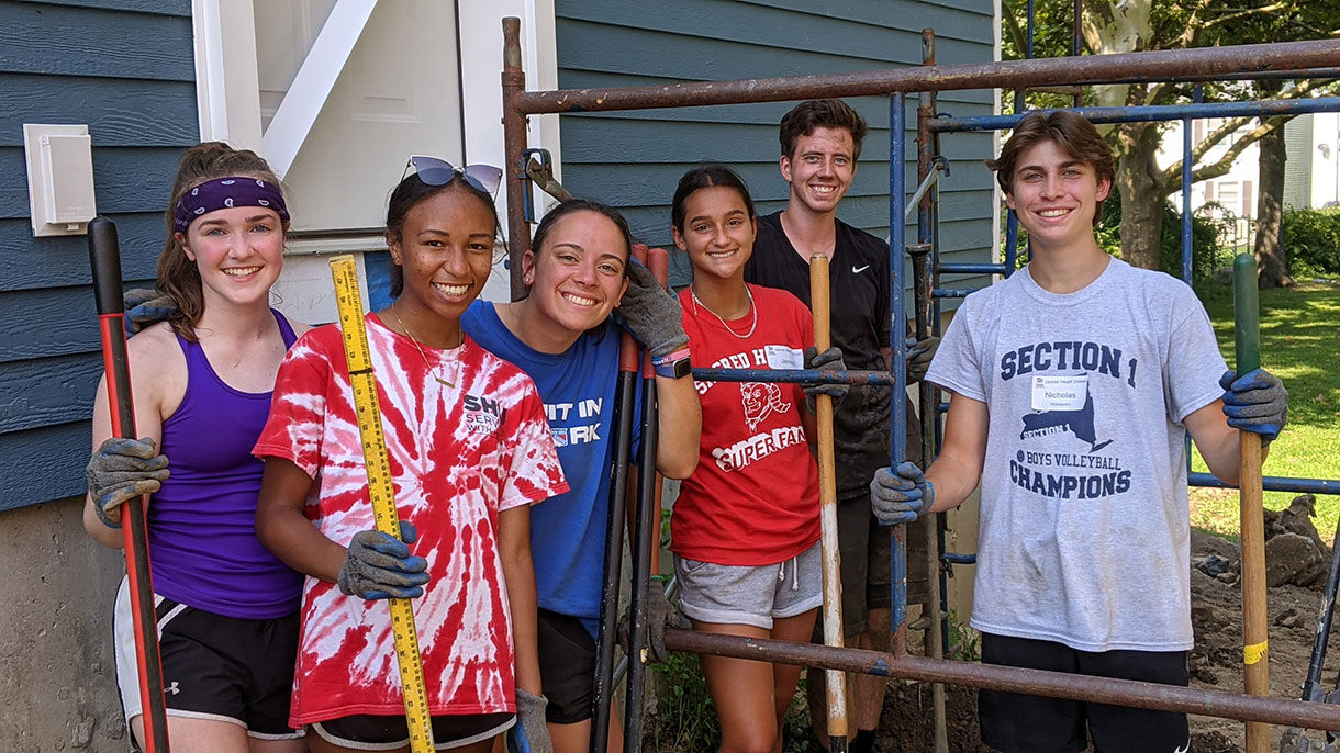 Student volunteers working on landscape project with Habitat for Humanity