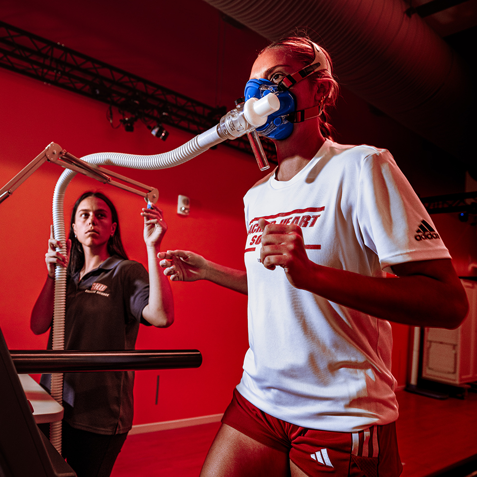 a person on a treadmill with a breathing apparatus