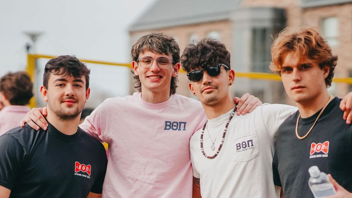 Members of Beta Theta Pi at a brotherhood event, smiling for a photo