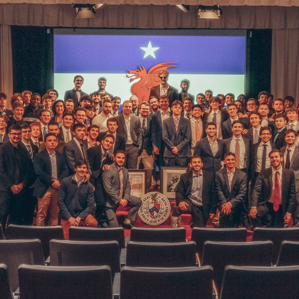 Members of Beta Theta Pi at brotherhood event. All dressed in suit jacket, tie, dress pants