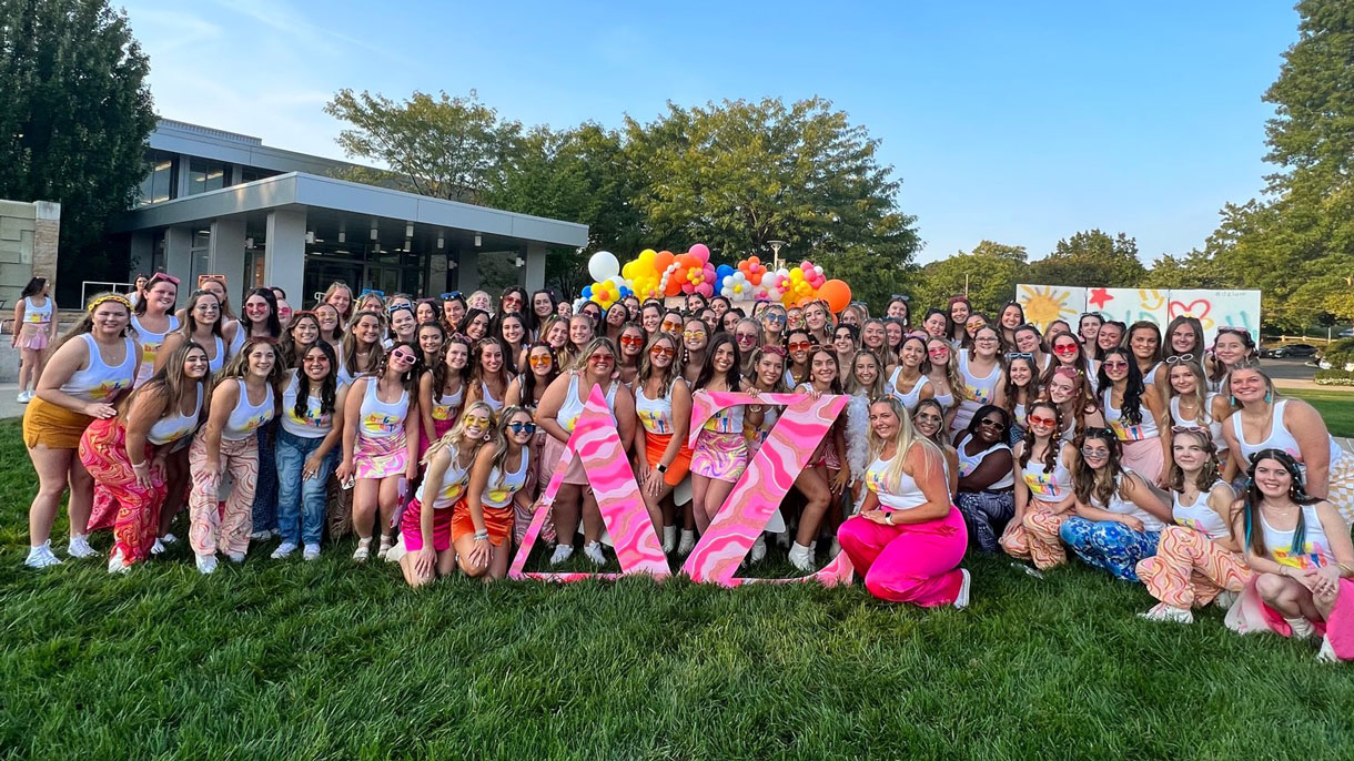 Delta Zeta members on bid day outside on the quad