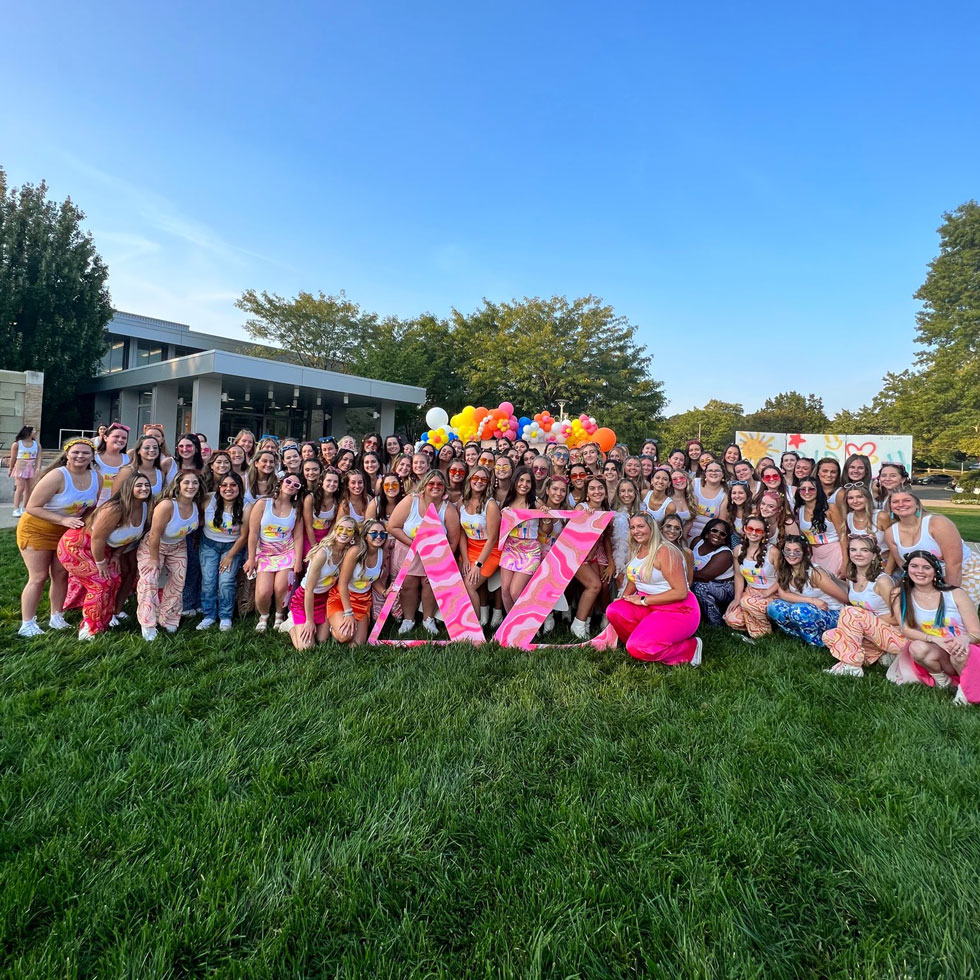 Delta Zeta members on bid day outside on the quad