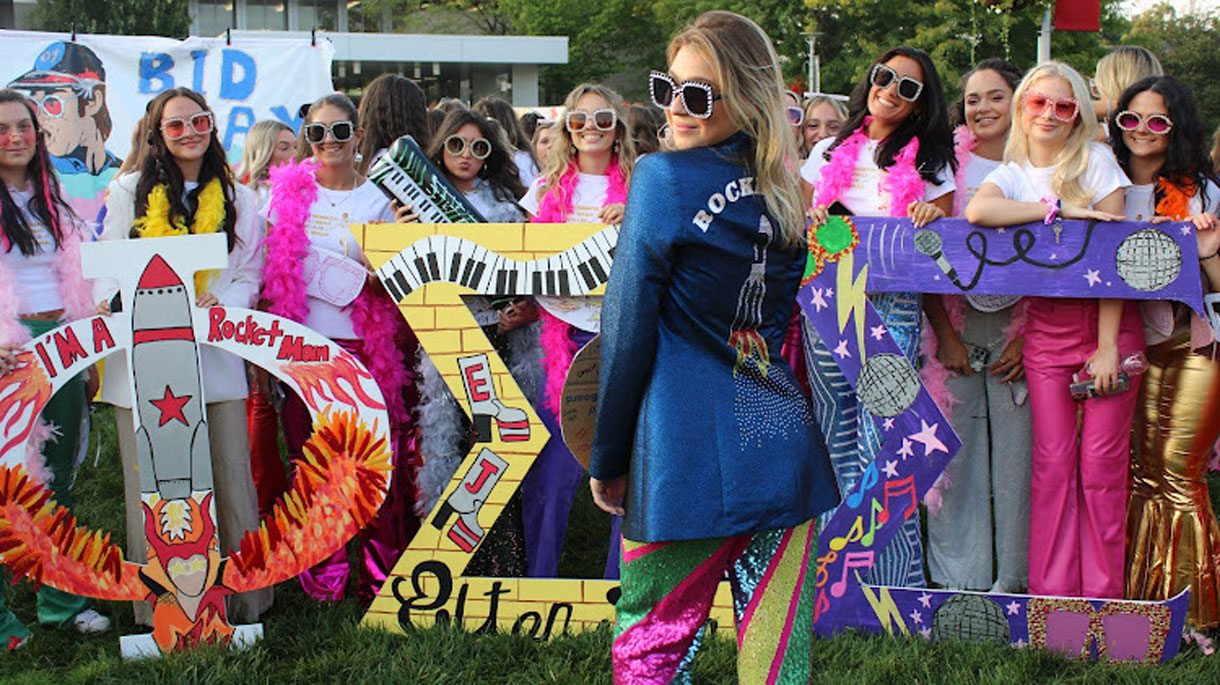 Members of Phi Sigma Sigma during Bid Day wearing Elton John inspired outfits