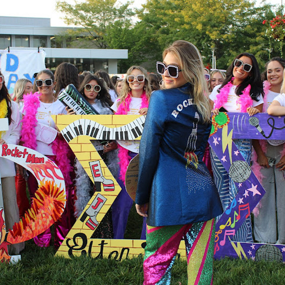 Members of Phi Sigma Sigma during Bid Day wearing Elton John inspired outfits