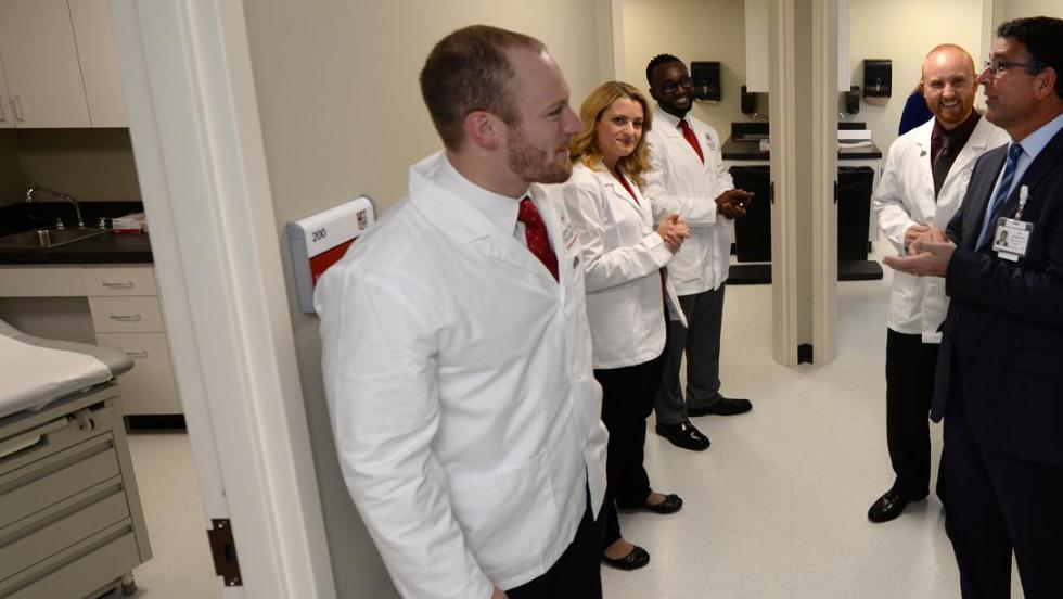 Doctors talking in hospital hallway