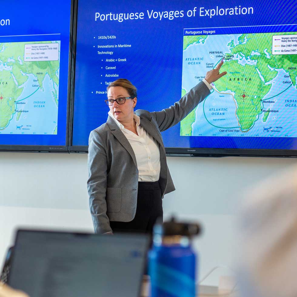 Professor pointing at map