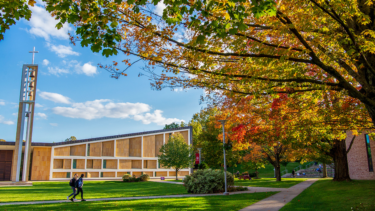 students walk by SHU's Chapel of the Holy Spirit