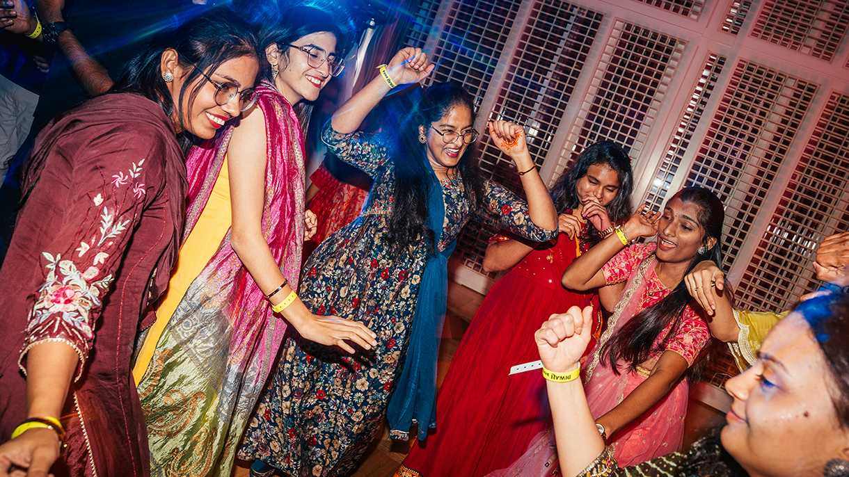 people dancing at a Diwali celebration