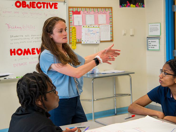 Teacher speaking to students in classroom