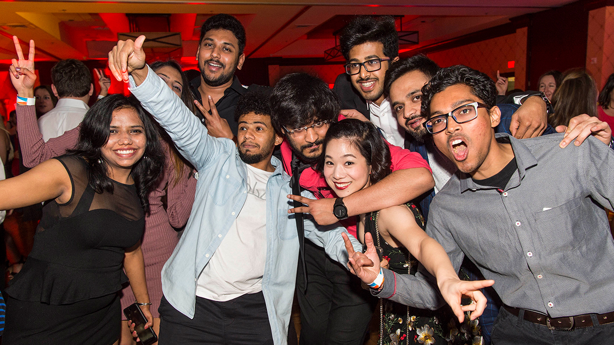 graduate students dancing at a gala event