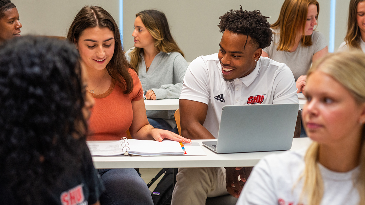 college students collaborate in class
