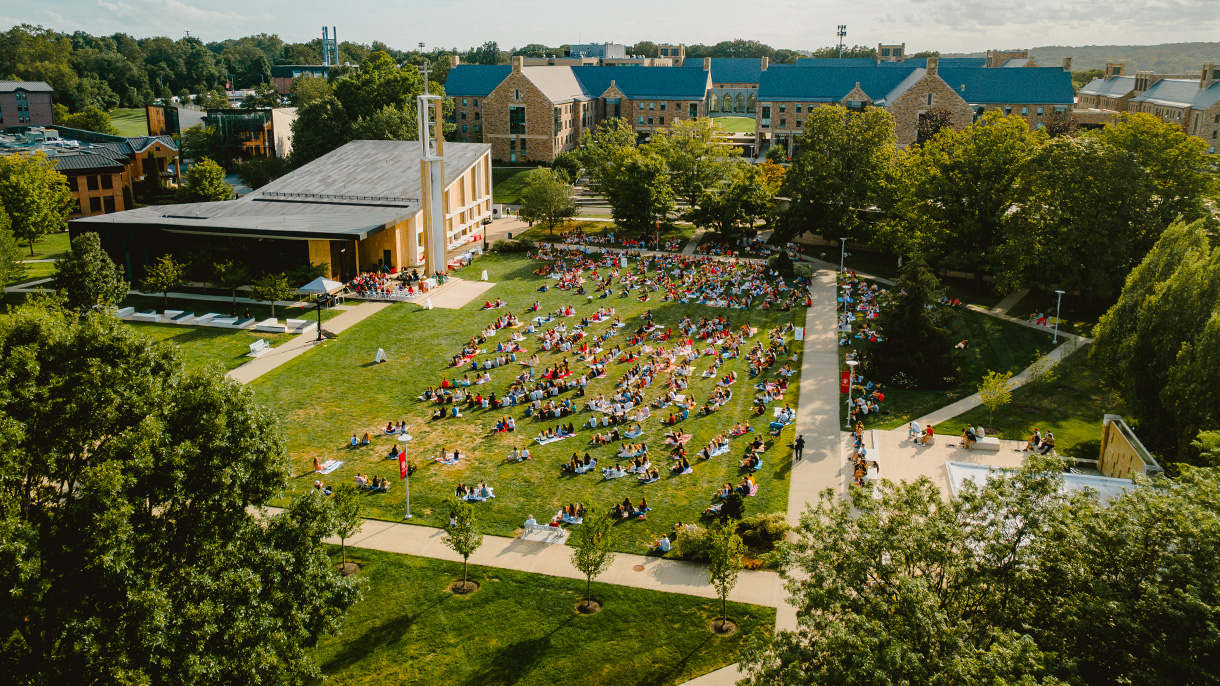 outdoor catholic mass on a college quadrangle