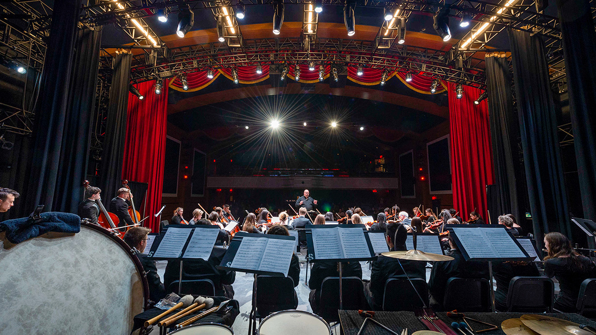 an orchestra performing on stage