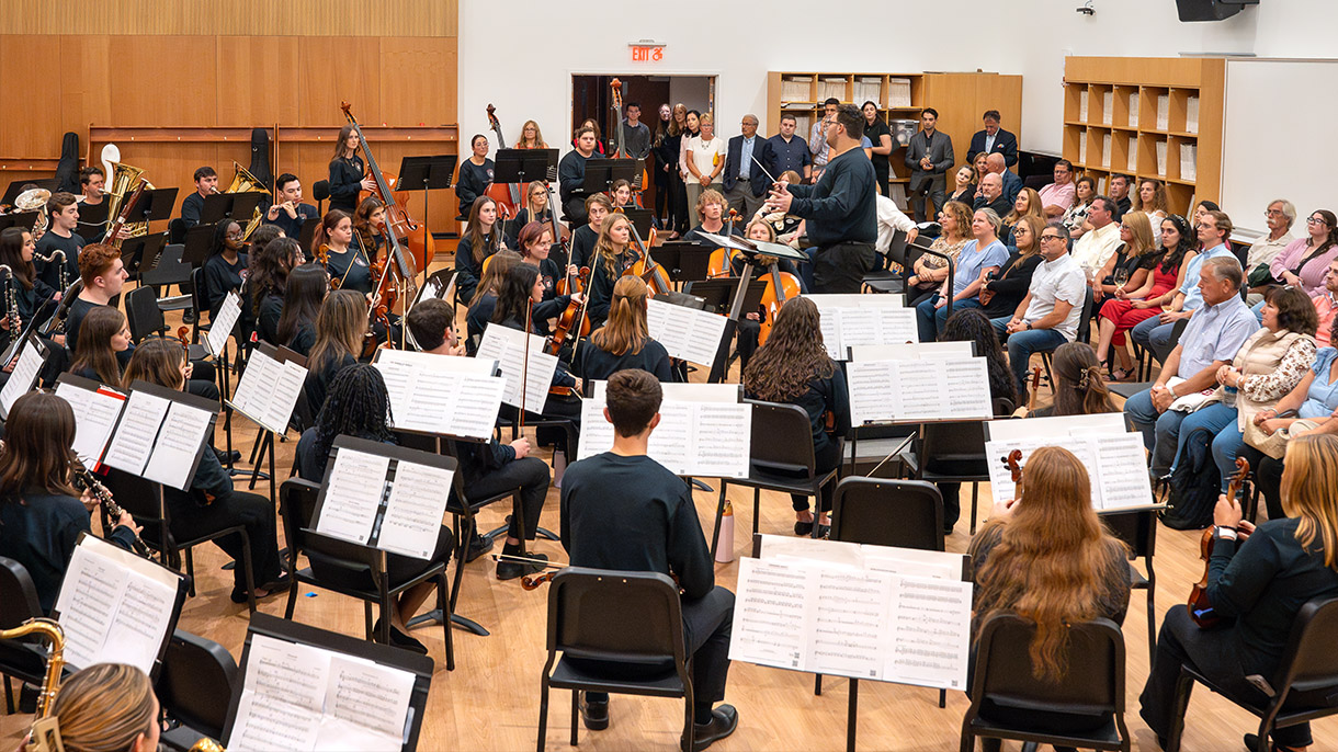 an orchestra and band perform