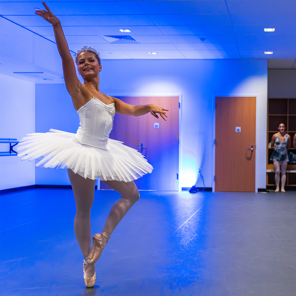 a ballerina in a dance studio