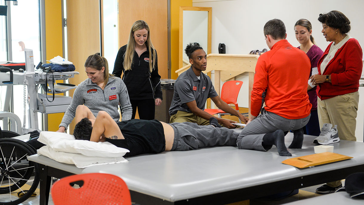 Sacred heart students in the Physical Therapy lab