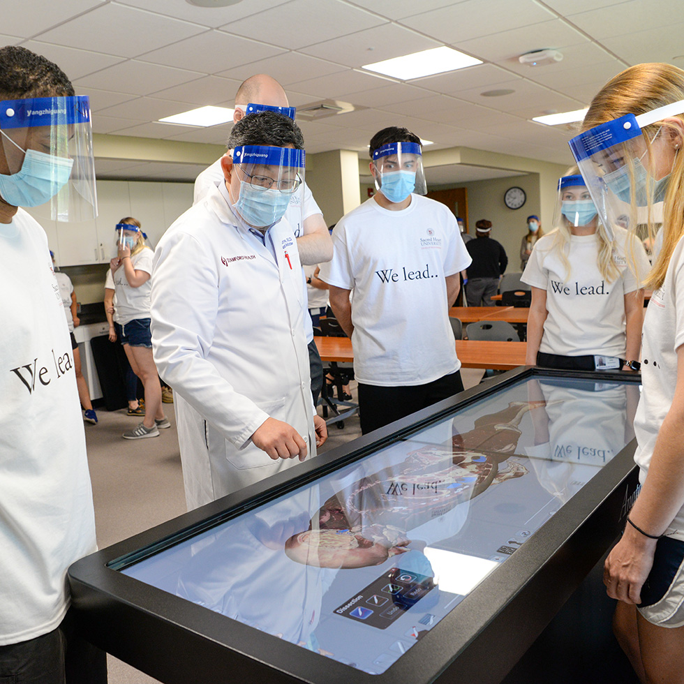 Physician assistant students and faculty participating in a lab at the Tandent Center in Stamford, CT.