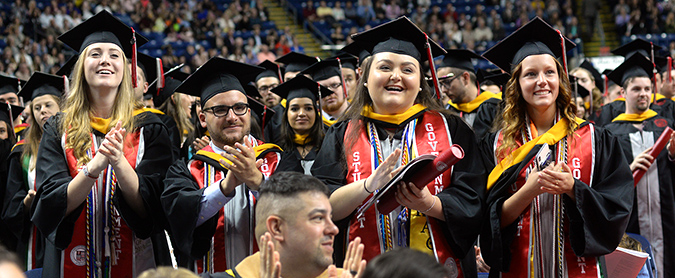 Students clapping at graduation