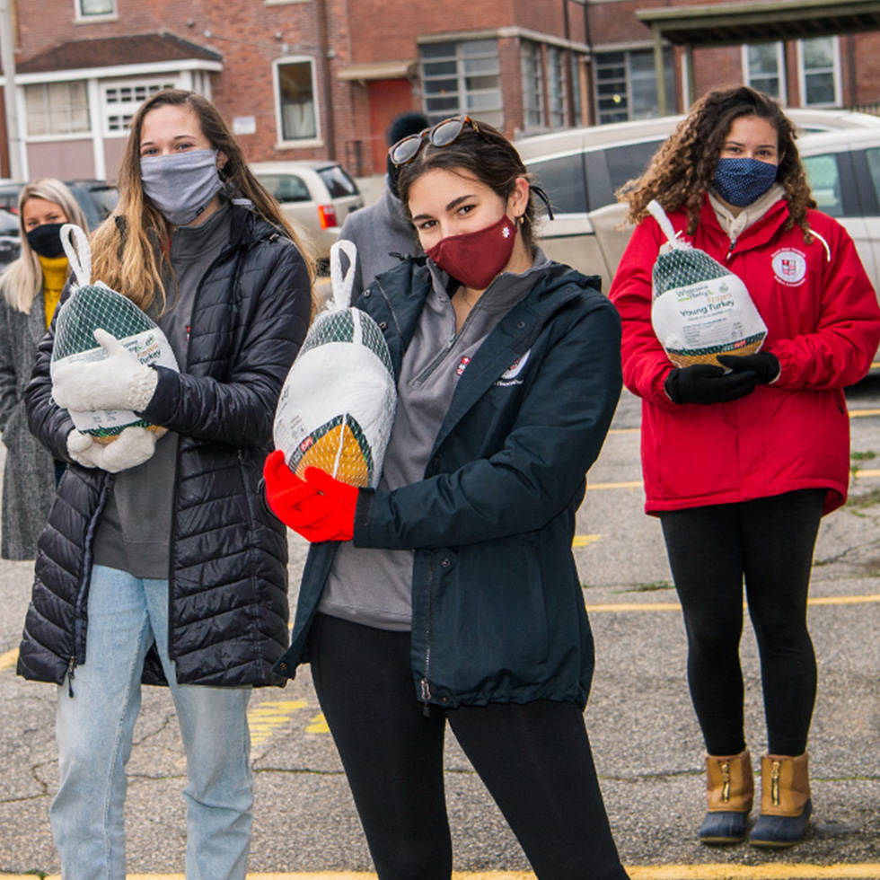 college students with Thanksgiving turkeys