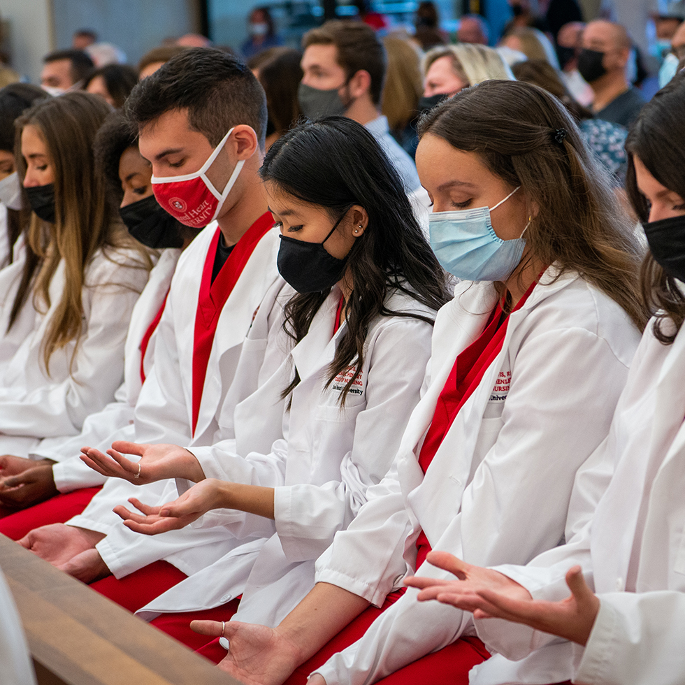 nursing students looking at their hands