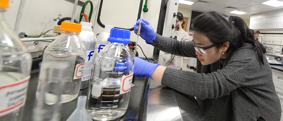 college student working in a chemistry lab